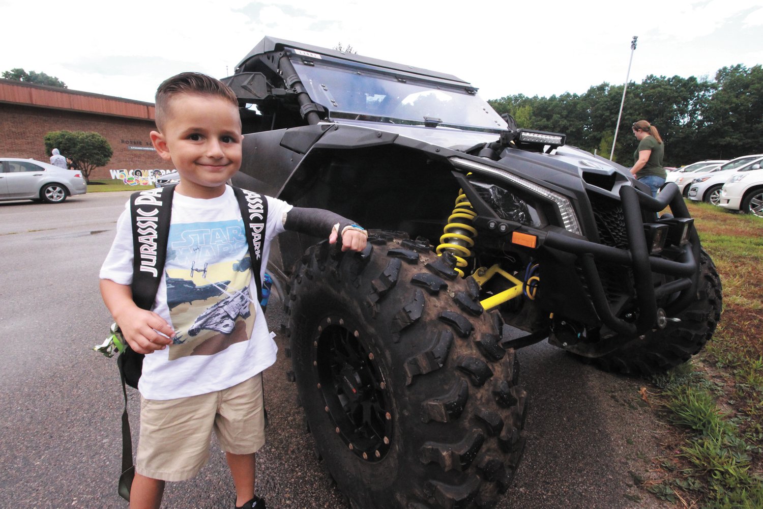 SOME WHEELS: Hoxsie kindergartener Liam Feola got a special ride on the first day of school in this Can Am that drew looks from fellow students and adults